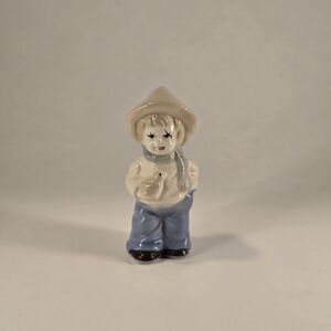 ceramic figurine Dutch Farm young Girl wearing a hat and scarf holding a duck